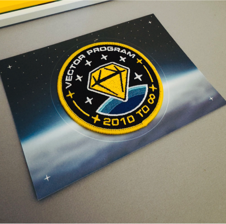 Commemorative patch close-up on printed card